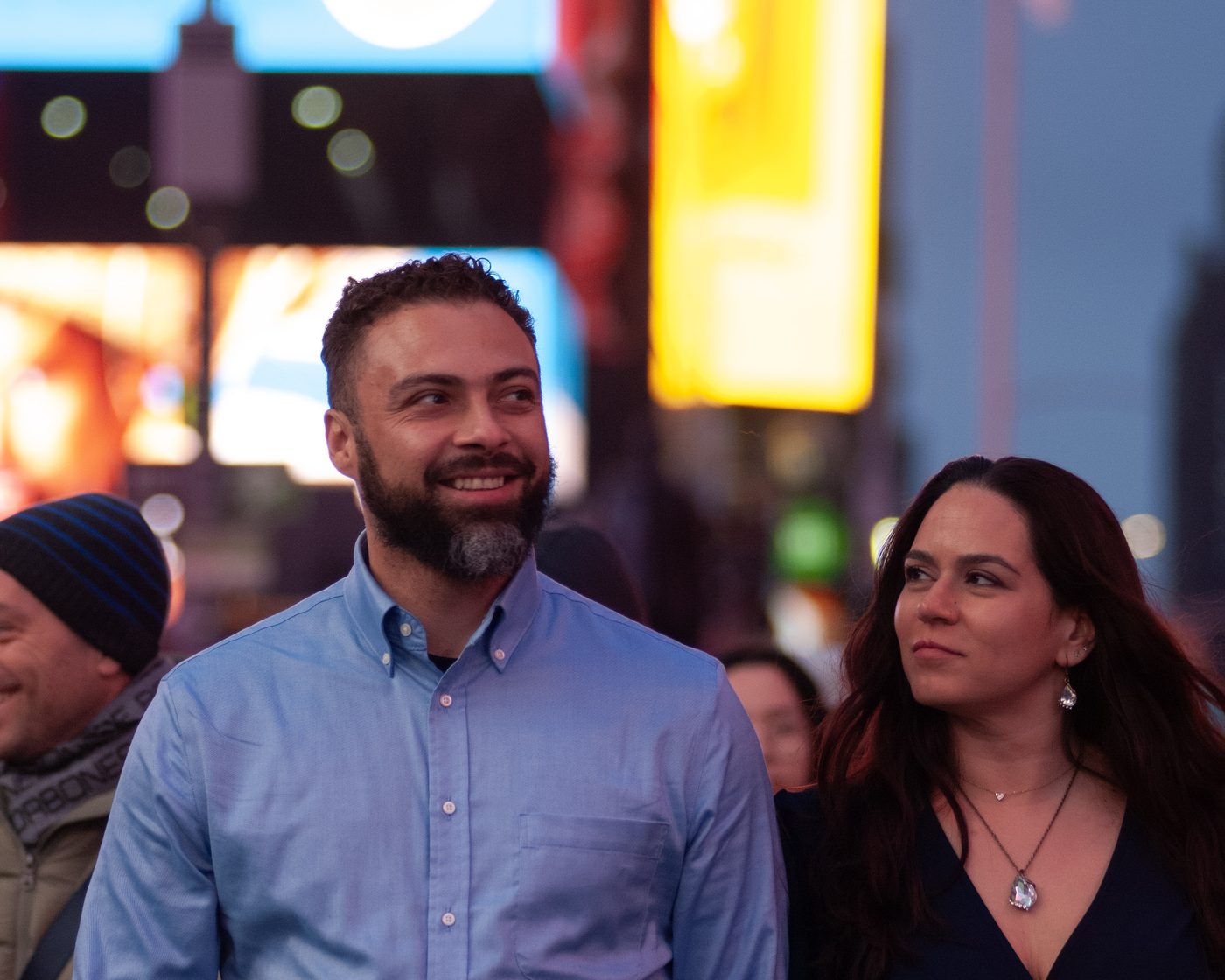 Casey and Nicole walking hand in hand through Times Square
